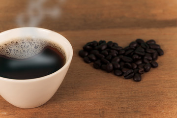 hot coffee mug on wood.