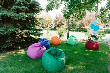 Coloroful beanbags outdoors with noone