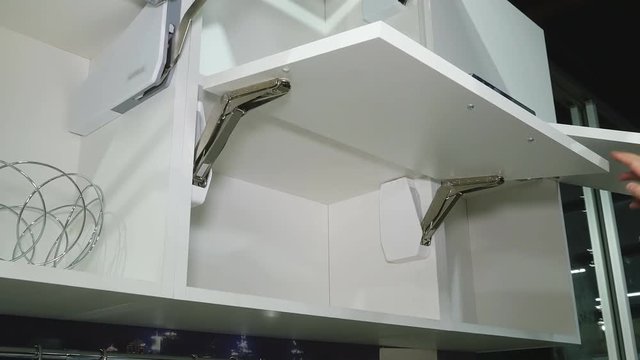 Kitchen white furniture. Pull-out cabinets.