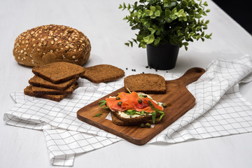 Salmon Sandwich on wooden plate