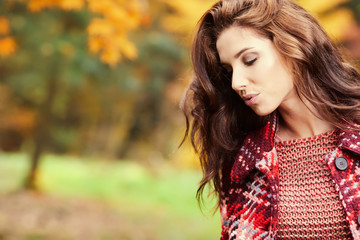 Fototapeta premium season and people concept - beautiful happy young woman walking in autumn park