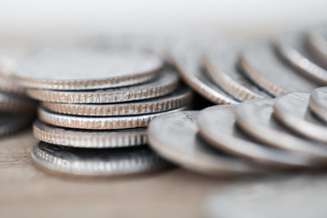 Row of coins on wood background for finance and Saving concept,Investment, Economy, Soft focus and dark style.