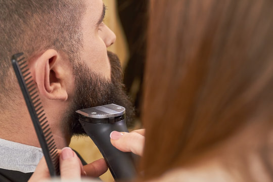 Beard Grooming Process, Close Up. Barber Using A Trimmer.