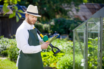 portrait of a smiling greenhouse worker