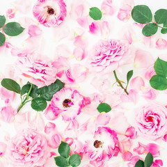Pink roses and ranunculus flowers, leaves and petals on white background. Flat lay, top view