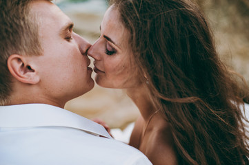 Beautiful wedding couple on a walk by the sea