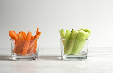 Carrot and cucumber sticks in a glass
