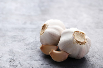 Garlic on the grey wooden table