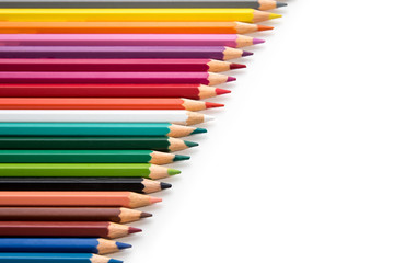 Colored pencils on white background