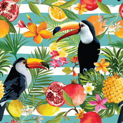 Seamless Tropical Fruits and Toucan Pattern in Vector. Pomegranate, Lemon, Orange Flowers, Leaves and Fruits Background. © wooster