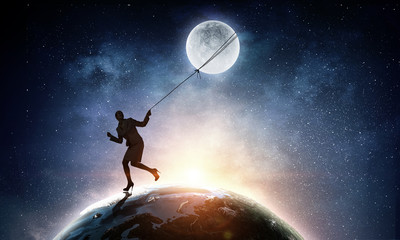 Fototapeta na wymiar Woman catching moon