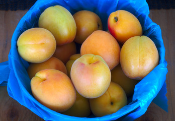 many organic peaches fruit basket at the market