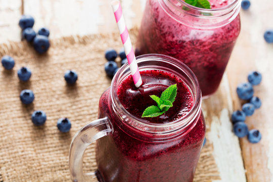 Berries smoothies in glass with blueberries