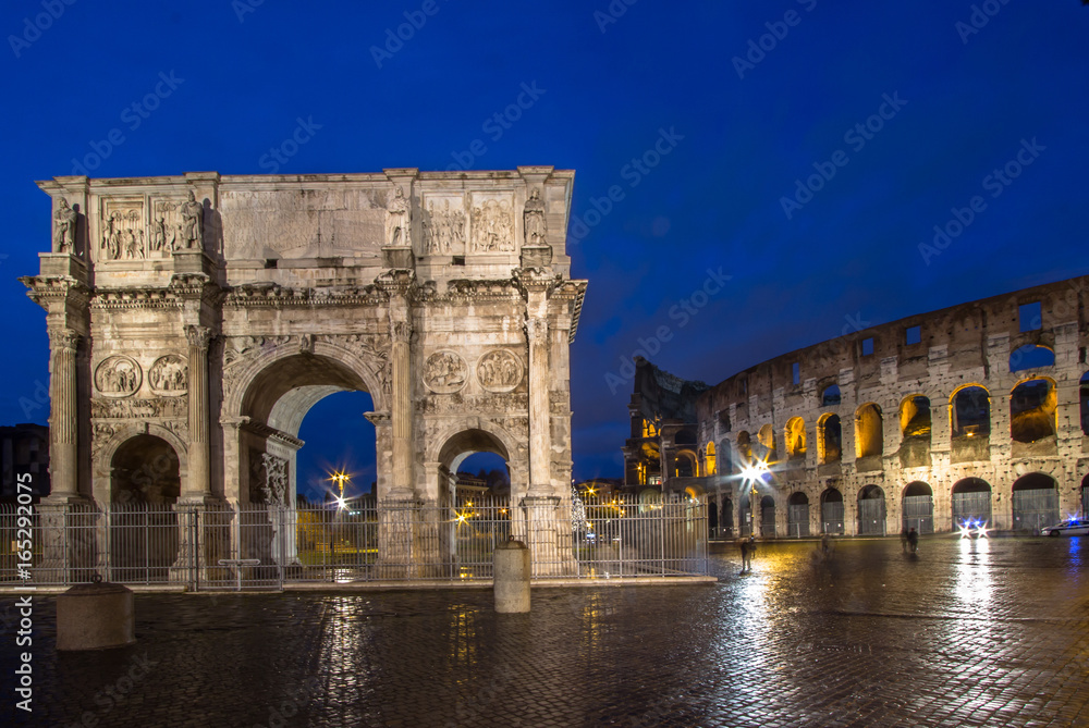 Wall mural the colosseum and the arch of constantine in rome