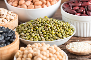 Mixed beans on wood background. Selective focus.