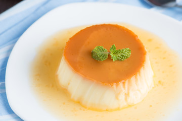Close up, Caramel custard pudding in white plate.