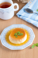 Caramel custard pudding and hot tea.