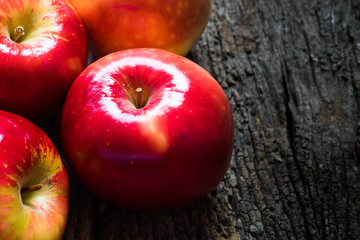 Red apples on wood,