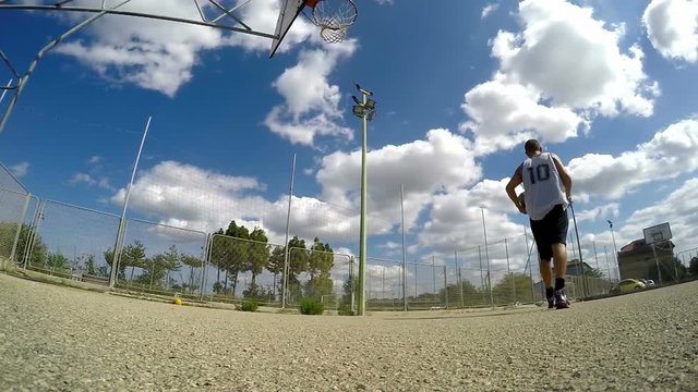 Basketball player practicing in a playground