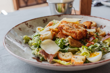 Caesar salad in a round plate