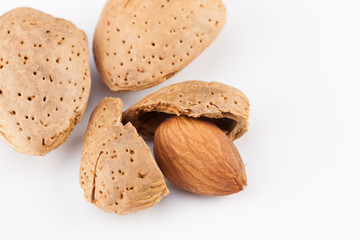 Whole almonds nuts isolated on white background