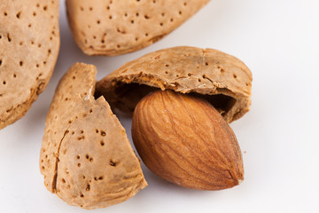 Whole almonds nuts isolated on white background
