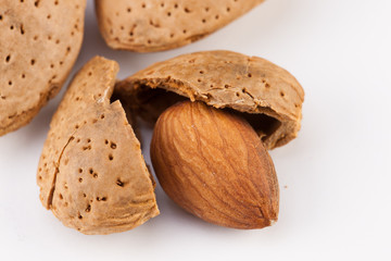 Whole almonds nuts isolated on white background