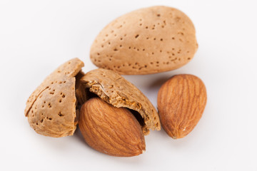 Whole almonds nuts isolated on white background