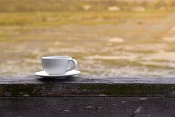 A cup of coffee on wood table