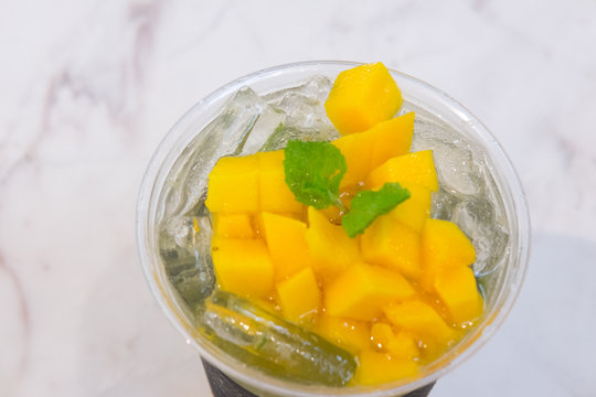 Tropical lemonade with mango slice