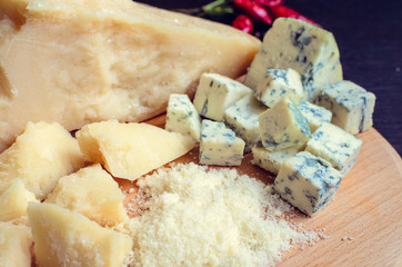 Grated Parmesan and sliced Blue cheese