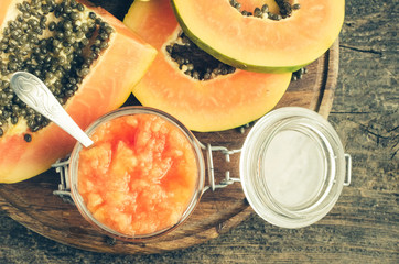 Slices of sweet papaya on wooden background