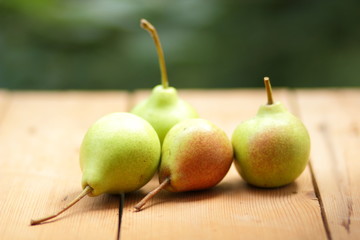 Pears on the background of a green bokeh