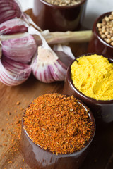 Spices and herbs in ceramic bowls. Food and cuisine ingredients. Colorful natural additives.