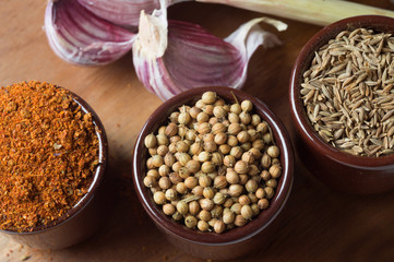 Spices and herbs in ceramic bowls. Food and cuisine ingredients. Colorful natural additives.