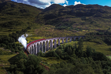 Train on famous Glenfinnan viaduct, Scotland, United Kingdom