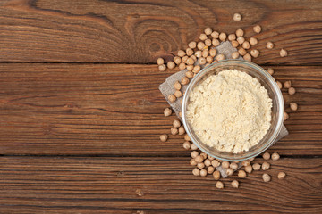 Chickpea flour in a wooden spoon