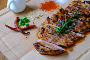 pork grill with sauce on wooden dish - 165308809