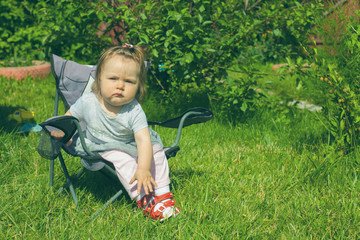 cute baby girl in park, toned photo