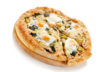 Vegetarian pizza with eggs, zucchini and onion