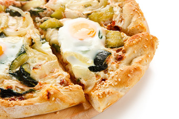 Vegetarian pizza with eggs, zucchini and onion