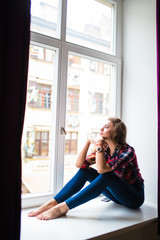 beauty Woman relax on windowsill background