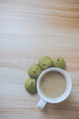 coffee and matcha bun on the wood table (toned)