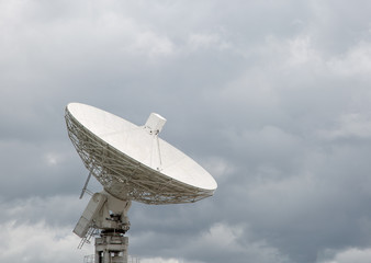 Radio telescope dish pointing at the sky
