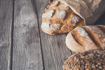 Bread background on rustic wood
