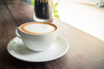 hot coffee mocha with foam milk in vintage cafe
