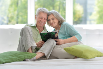 Senior couple with magazine