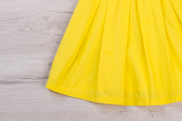 Detail of a yellow dress.