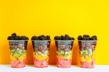 Fruit in a plastic cup.