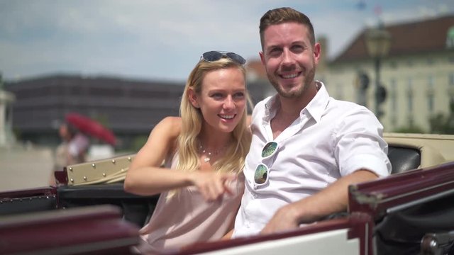 4K travel video happy smiling young sightseeing couple in horse drawn carriage in Vienna

